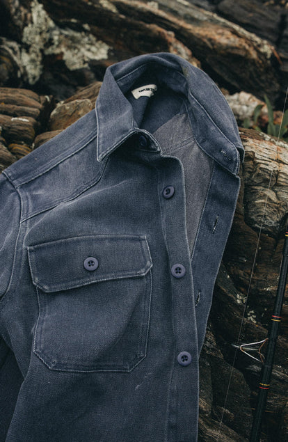 editorial image of The Shop Shirt in Navy Chipped Canvas on some rocks