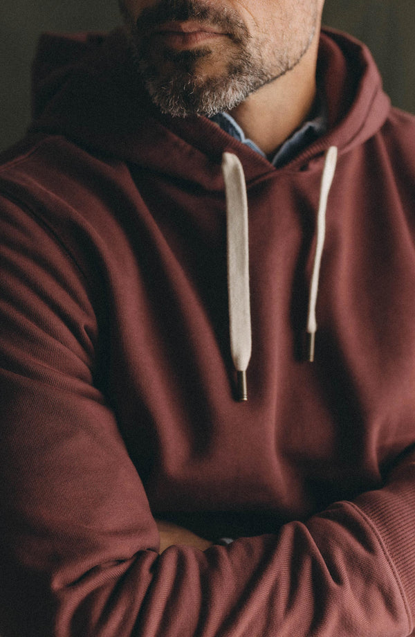 fit model showing off The Shop Hoodie in Dried Cherry