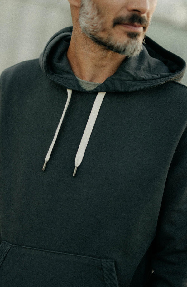 fit model showing off The Shop Hoodie in Faded Black