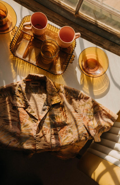 editorial flatlay of The Hawthorne Shirt in Tea Desert Palm