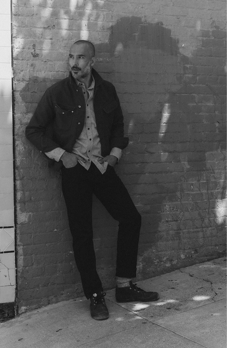 fit model posing in The Slim Jean in Rigid Black Organic Selvedge