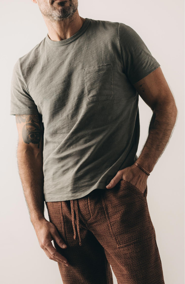 fit model posing in The Slub Tee in Smoked Olive