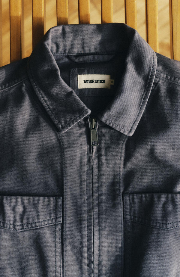 editorial flatlay of The Station Jacket in Petrol Blue Broken Twill