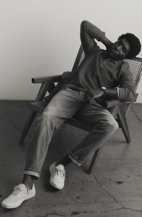 fit model sitting wearing The Straight Jean in Light Wash Organic Selvedge