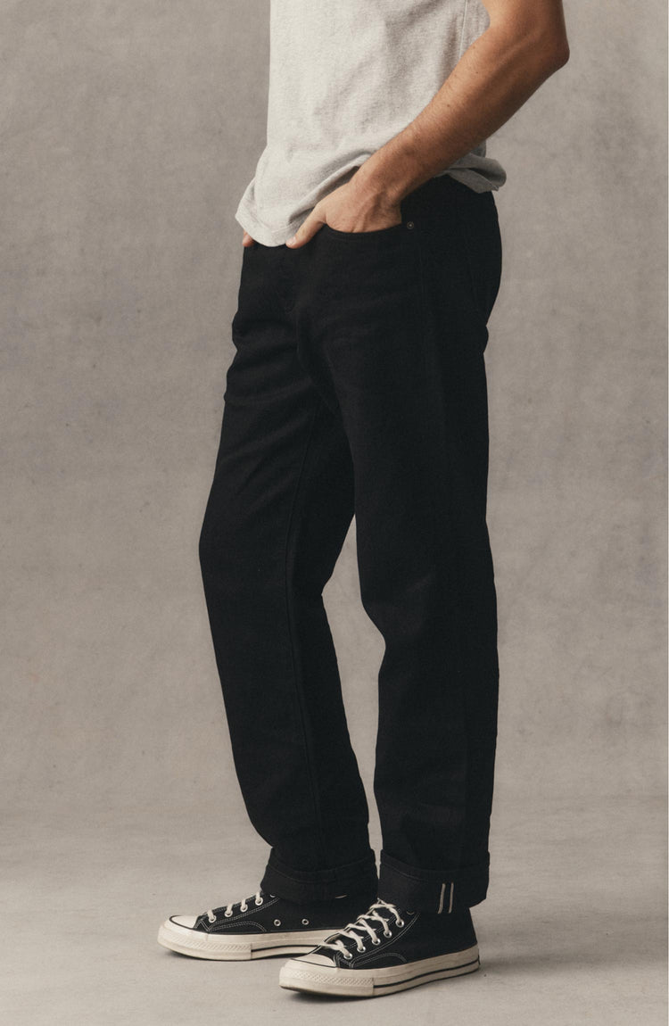 fit model posing in The Straight Jean in Rinsed Black Organic Selvedge