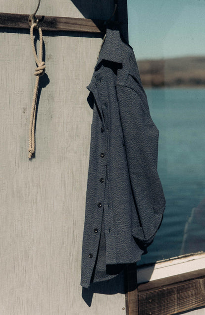 editorial image of The Utility Shirt in Indigo Ash Wool Canvas hanging