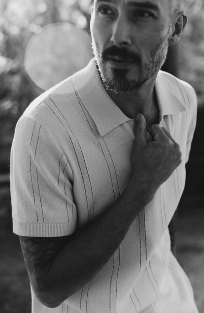 fit model posing in The Valencia Sweater Polo in Heather Oat Rib