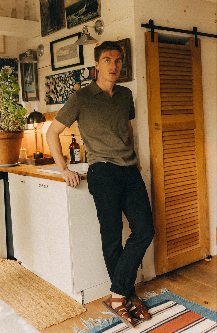 fit model posing in The Valencia Sweater Polo in Heather Cilantro Rib