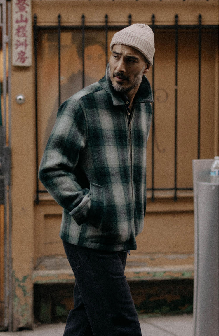 fit model walking wearing The Waterfront Jacket in Evergreen Plaid Wool