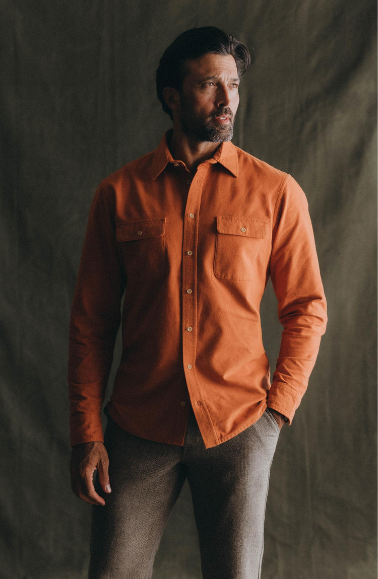 fit model posing in The Yosemite Shirt in Summit Orange