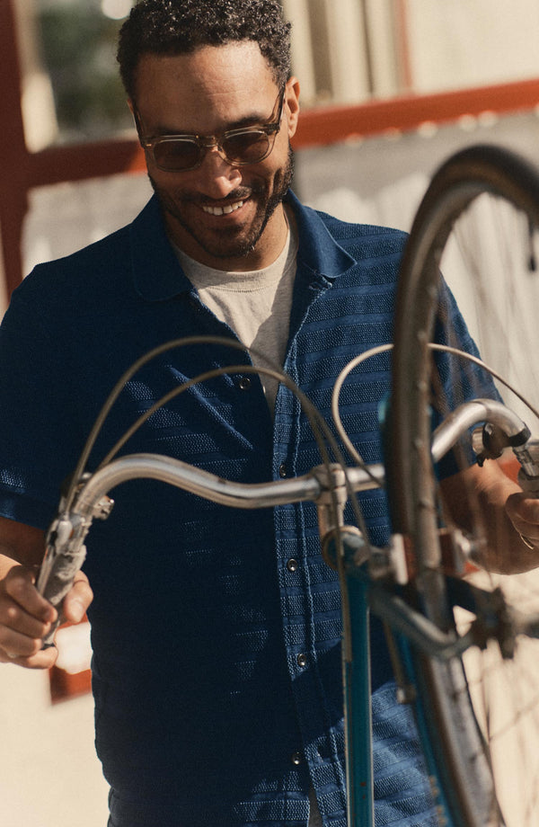 fit model wearing The Bywater Polo in Rinsed Indigo Knit Stripe