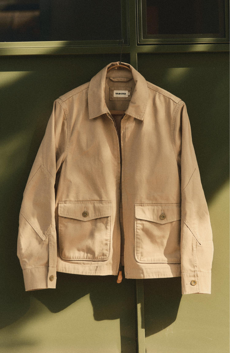 editorial image of The Airman Jacket in Organic Khaki Foundation Twill hanging
