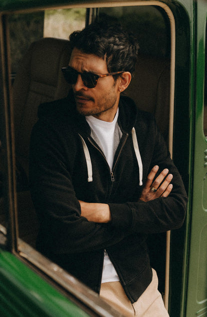 fit model posing in The Apres Zip Hoodie in Black Indigo Terry