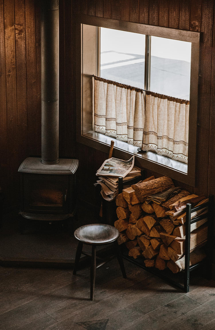 Shot of stool and firewood in the living room