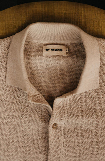 material shot of the collar on The Button Down Polo in Heather Oat Herringbone