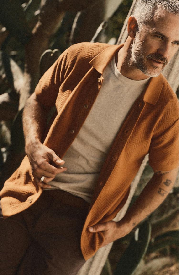 fit model posing in The Button Down Polo in Desert Herringbone