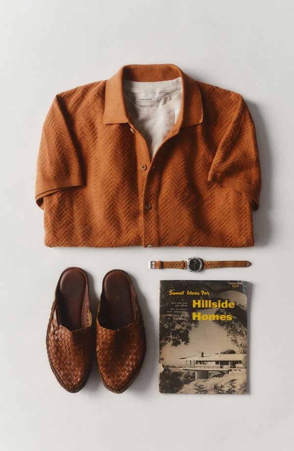 editorial flatlay of The Button Down Polo in Desert Herringbone