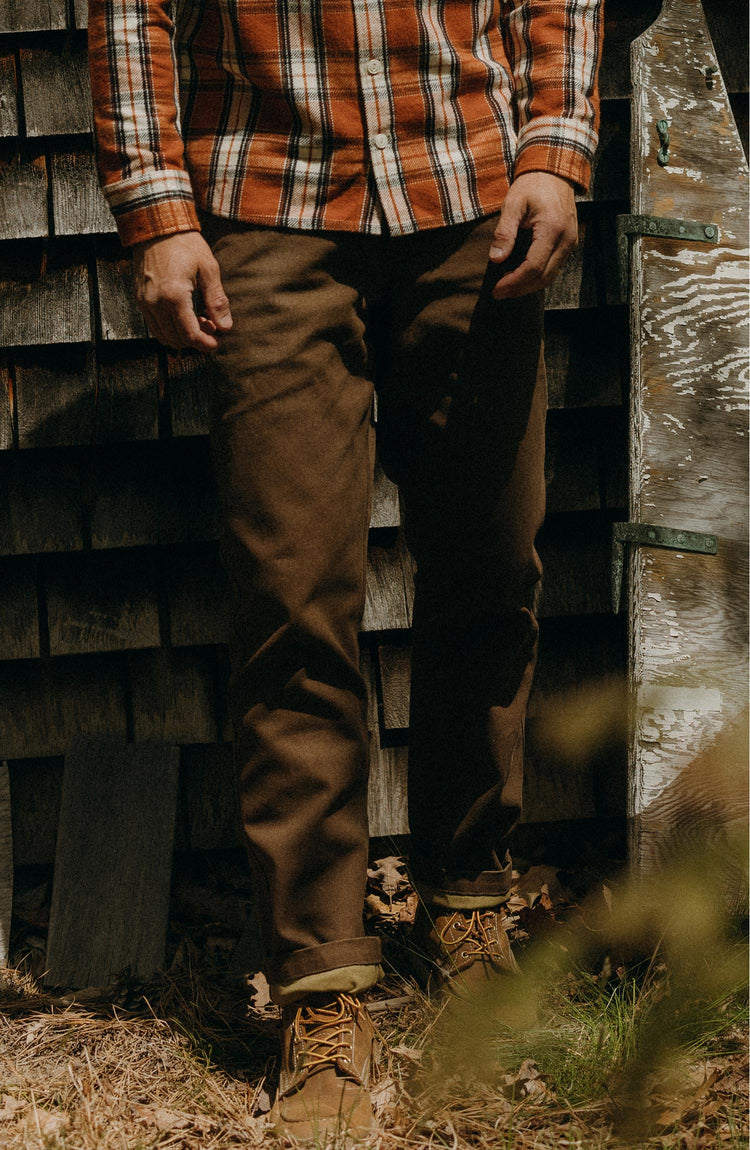 fit model sitting wearing The Camp Pant in Aged Penny Chipped Canvas
