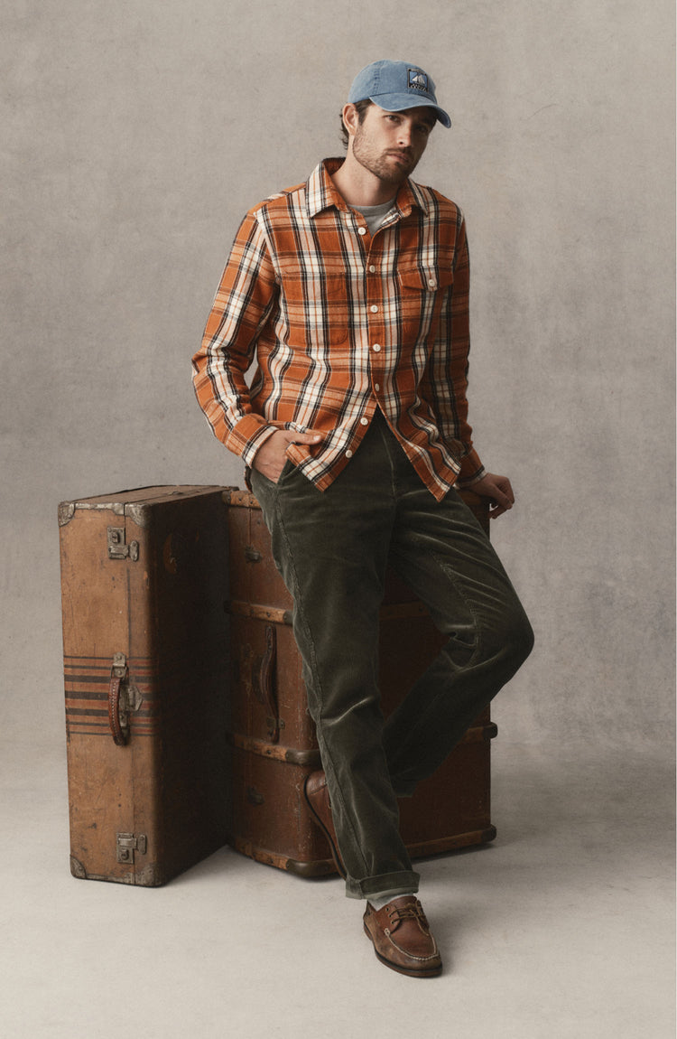 fit model posing in The Carnegie Pant in Smoked Olive Corduroy