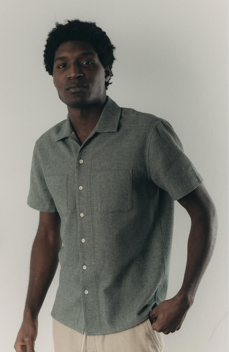 fit model sitting wearing The Conrad Shirt in Deep Sea Twist