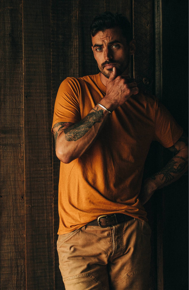 Model standing in front of door wearing tee shirt