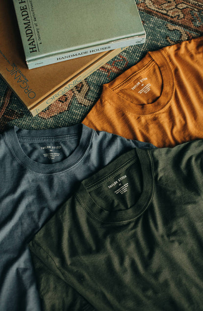 Group of three shirts on the floor