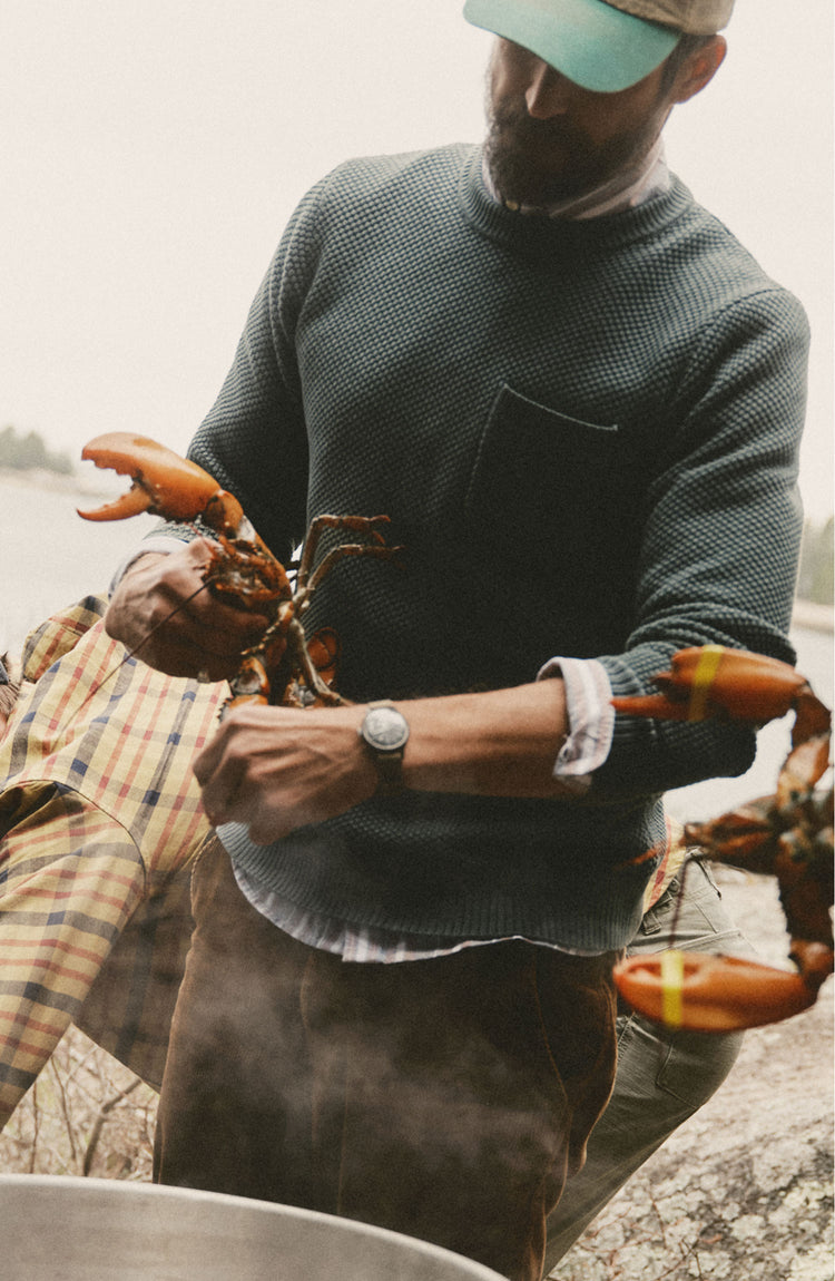 fit model posing in The Crawford Crew Sweater in Faded Spruce