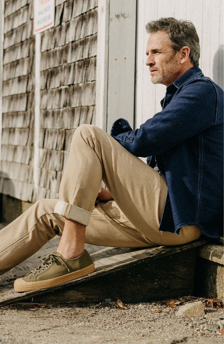 Our model wearing The Democratic All Day Pant in Light Khaki Broken Twill
