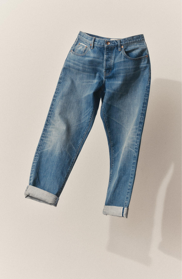 editorial image of The Democratic Jean in Light Wash Hemp Denim in the air