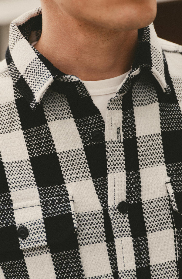 fit model showing off The Division Shirt in Black Indigo Check