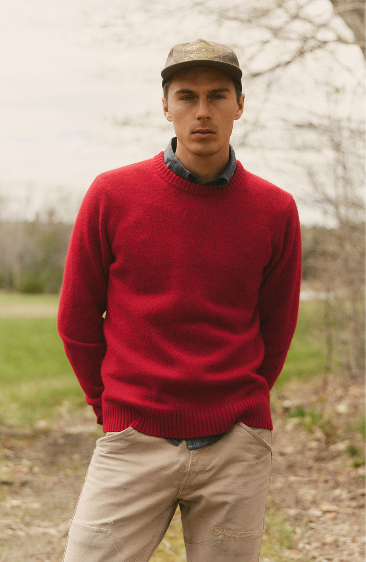 fit model posing in The Eastmoor Sweater in Claret Wool
