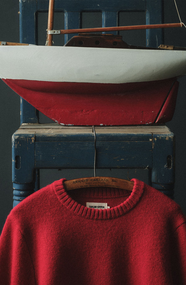 editorial image of The Eastmoor Sweater in Claret Wool hanging