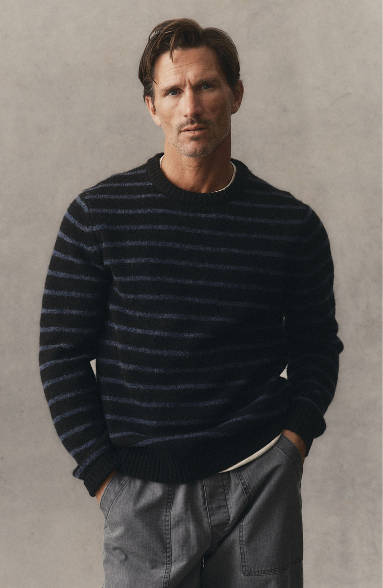 fit model posing in The Eastmoor Sweater in Coal Stripe Wool