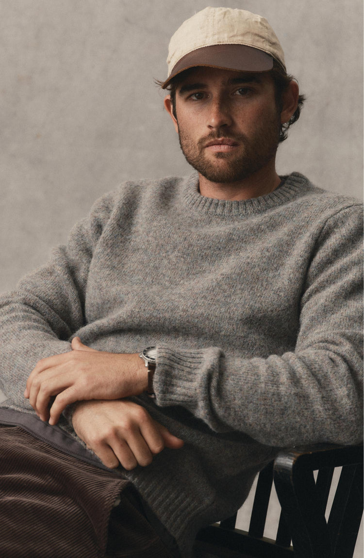 fit model posing in The Eastmoor Sweater in Glen Wool