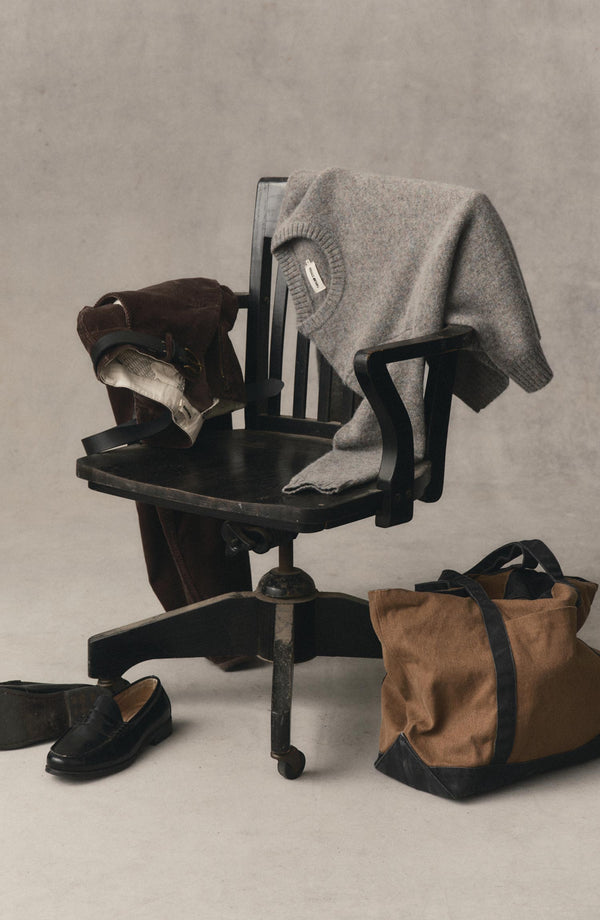 editorial image of The Eastmoor Sweater in Glen Wool on a chair
