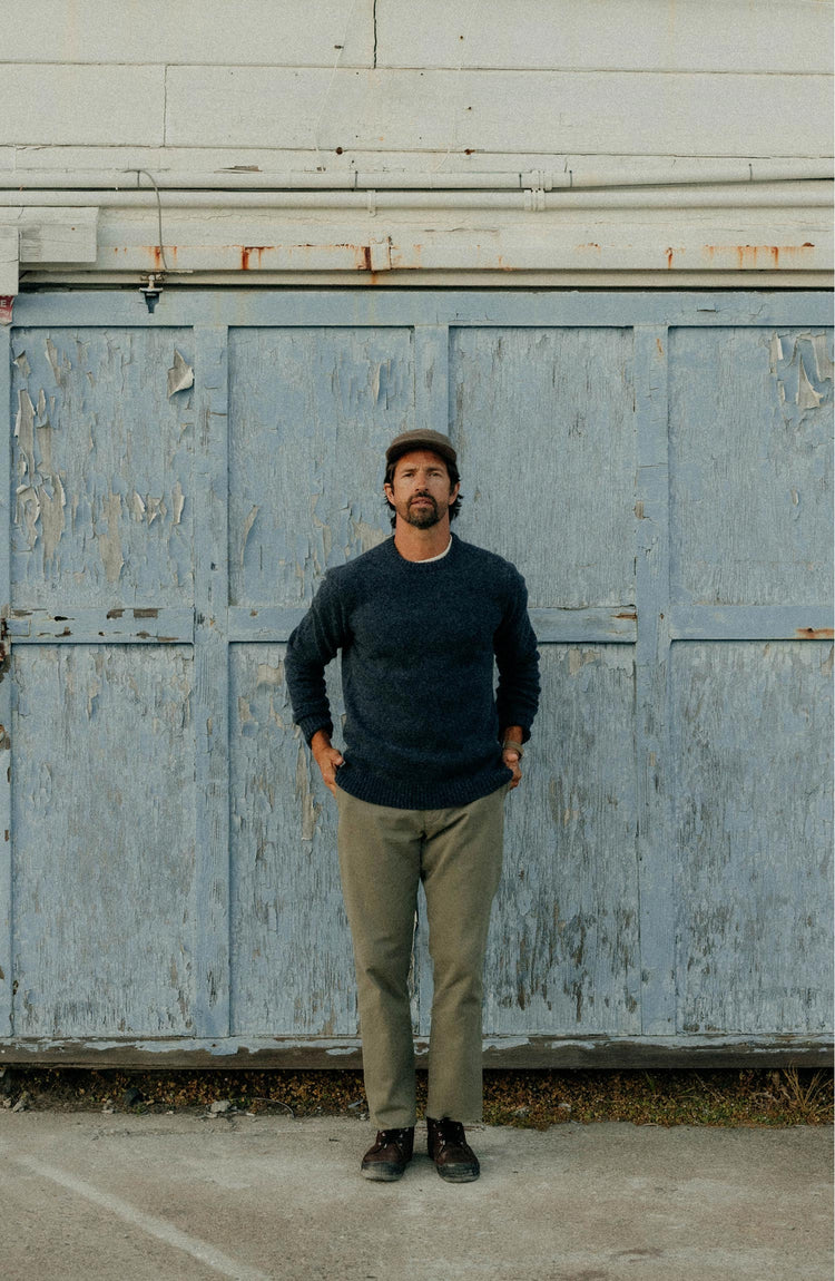 fit model posing in The Eastmoor Sweater in Heather Night Wool