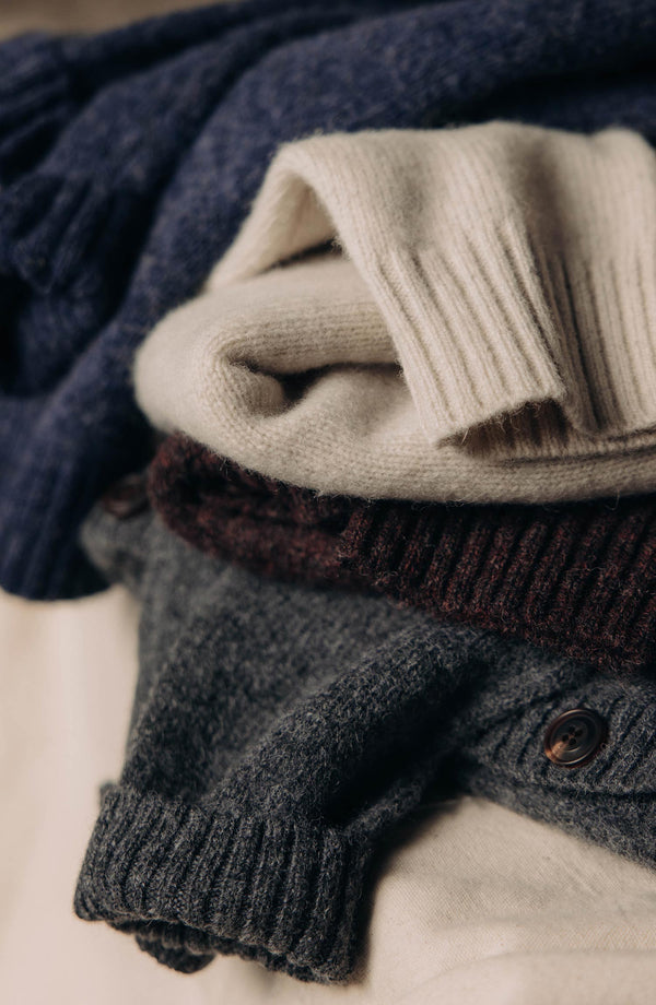 editorial image of The Eastmoor Sweater in Heather Night Wool with other sweaters
