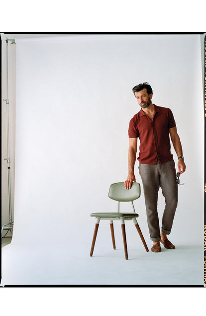 fit model standing next to a chair wearing The Easy Pant in Cocoa Linen