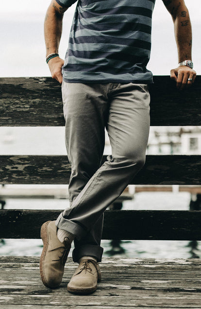 A pair of Foundation Pants folded on a black background.