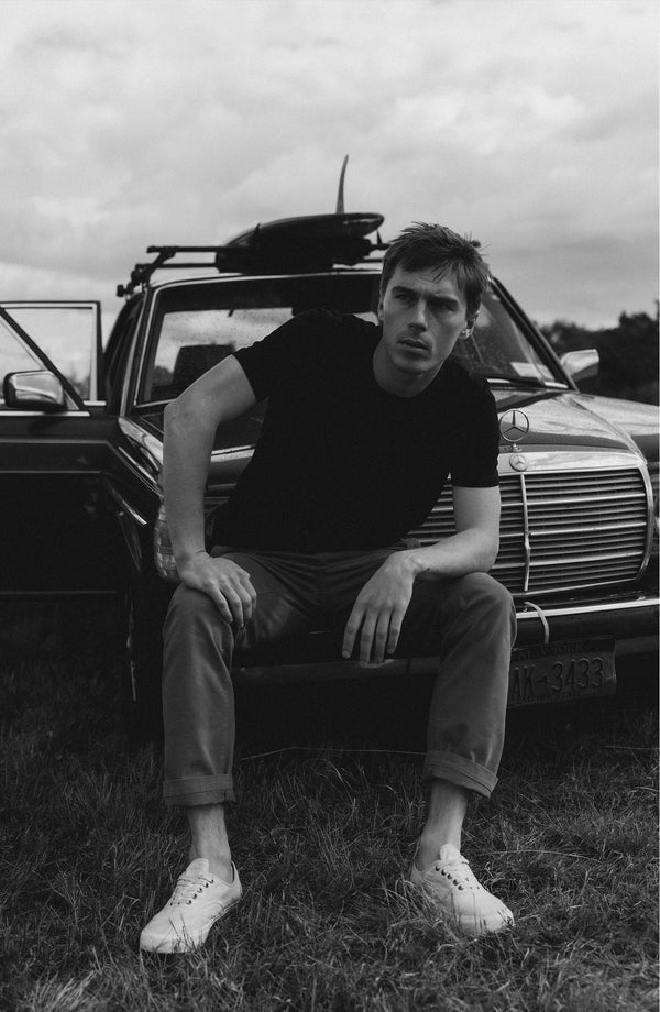 A pair of Foundation Pants folded on a black background.