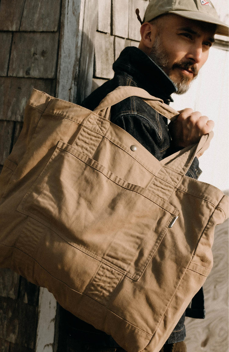 fit model posing wearing The Foundation Tote in Organic Khaki