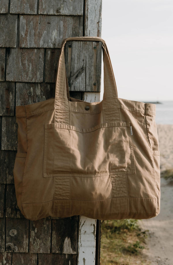 editorial image of The Foundation Tote in Organic Khaki hanging