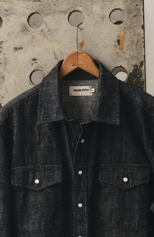 editorial image of The Glacier Shirt in Black Indigo Hemp Denim hanging