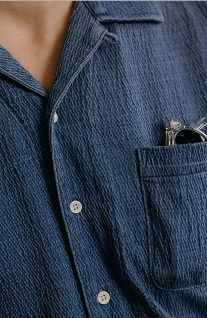 fit model showing off the buttons on The Hawthorne Shirt in Washed Indigo Crepe