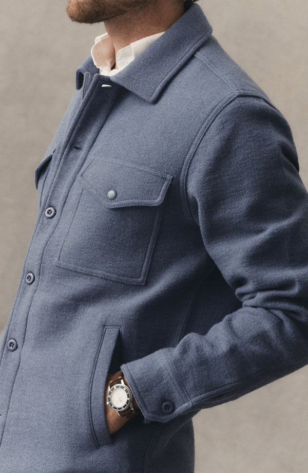 fit model showing off the pockets on The Kenne Shirt Jacket in Blue Fog Cotton Wool Crepe