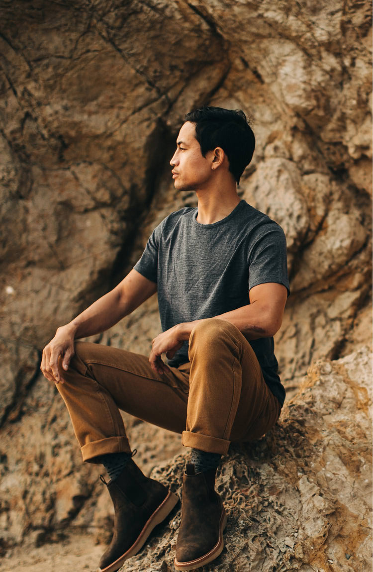 our guy rocking the merino tee near a cliff