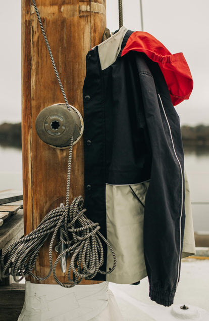 The Navigator in Natural and Navy Colorblock hanging on a yacht beam