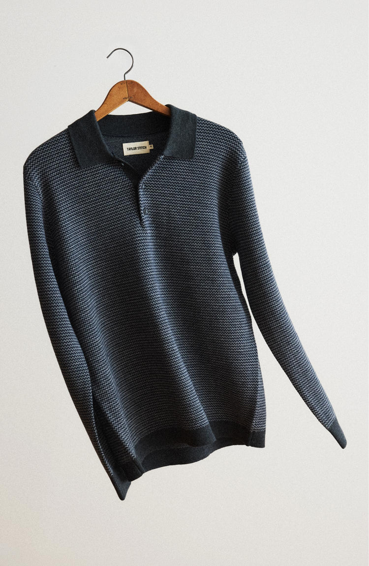 editorial image of The Newton Sweater Polo in Navy Birdseye Merino hanging