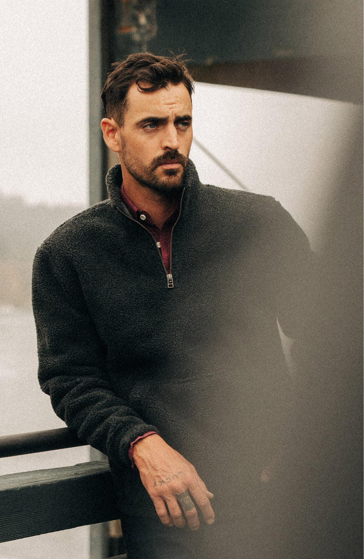 Model in The Nomad Pullover in Charcoal Heather Sherpa
