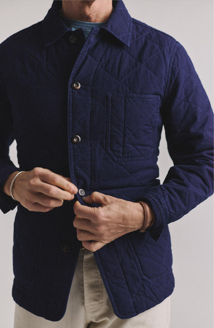 fit model buttoning up The Ojai Jacket in Indigo Diamond Quilt